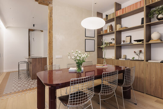 Full dining room with timber beam and hydraulic tile floor