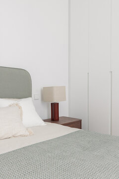 Bedroom white built-in wardrobes from foot of bed