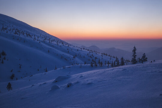 Serene winter scenes from the Carpathians captured during blue hour. 