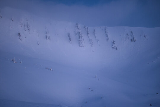 Snow-covered Carpathian mountains during the blue hour, 