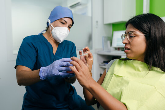 Dentist Showing Patient Clear Aligner