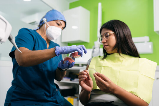 Dentist Explaining Clear Aligner to Patient