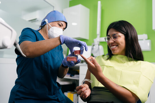 Dentist Explaining Dental Aligner to Patient