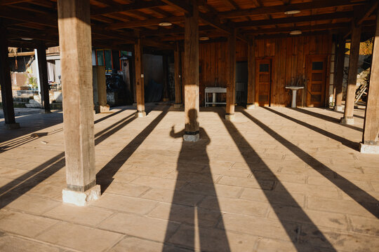 Long Shadows Cast Across Wooden Pavilion Floor