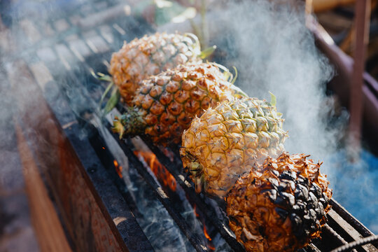 Pineapples Roasting Over Open Fire Grill