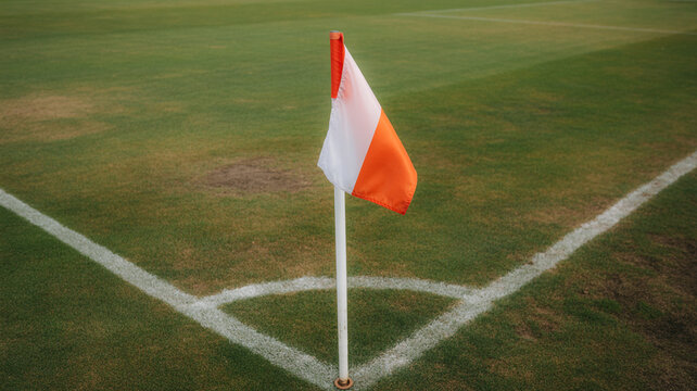 Close-up of a golf flag on a green field with a white and orange flag albatross quadruple thirteen fourteen seventeen eighteen