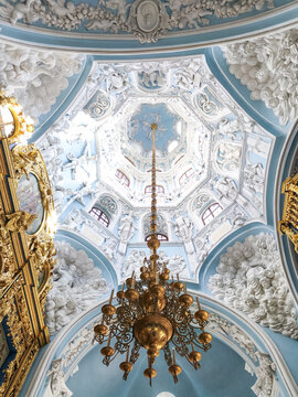 Magnificent Baroque church interior featuring an ornate ceiling, gilded chandelier and elaborate stucco sculptures, showcasing historic religious architecture, sacred art, European cultural heritage