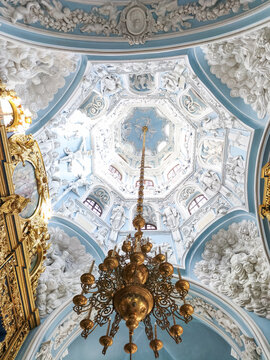 Magnificent Baroque church interior featuring an ornate ceiling, gilded chandelier and elaborate stucco sculptures, showcasing historic religious architecture, sacred art, European cultural heritage
