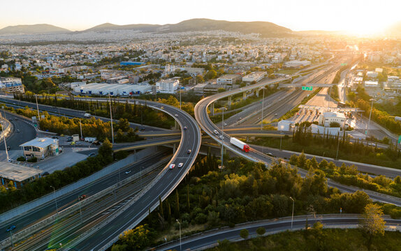 Modern urban highway interchange connecting roads at sunset