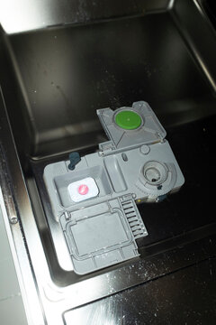 Close-up of modern technology tech dishwasher machine with flashlight