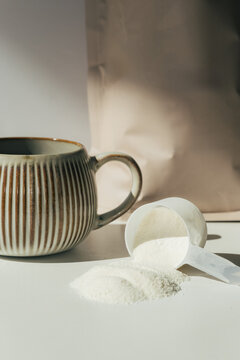 Collagen Powder Beside Coffee Mug