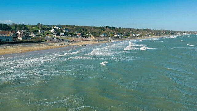 Omaha Beach coastline in Normandy, France, with Les Braves memorial. Drone view of the historic World War II landing beach