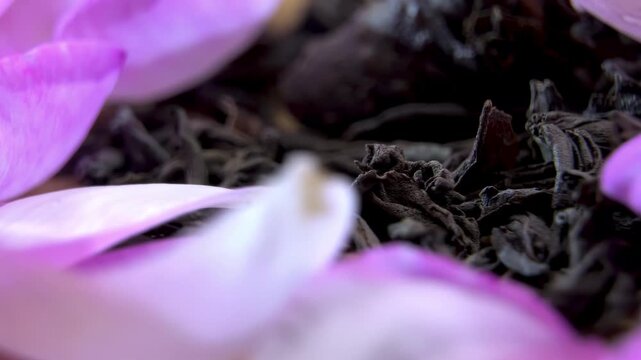 Rose Petals and Loose Leaf Tea Rotating, Detailed Botanical Close Up