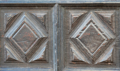 Antique carved wooden door panels with geometric diamond pattern © Travel Faery