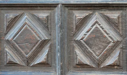 Antique carved wooden door panels with geometric diamond pattern © Travel Faery