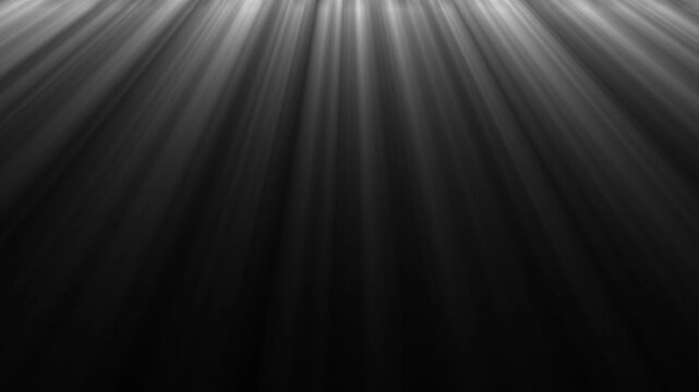 Gray light rays descend from top gradually darkening composite footage video descending beams