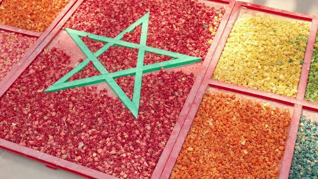 Colorful Dried Petals and Pigment Display in Market Tray With Moroccan Star Motif