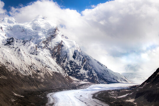 Drang Drung Glacier Winding Through Towering Snow Covered Himalayan Mountain Peaks, High Altitude Landscape Near Pensi La Zanskar Ladakh India