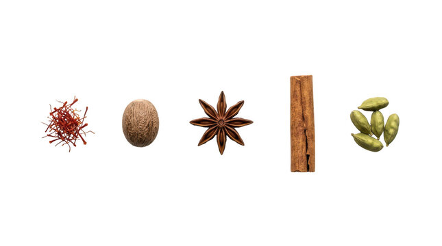 Assortment of aromatic spices including saffron nutmeg star anise cinnamon and cardamom pods for cooking and baking