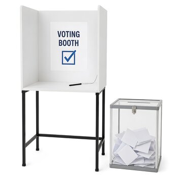 A voting booth stands with a sign indicating it is for voting. A ballot box is placed nearby, ready to collect votes. This setup is used for a public election