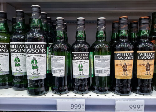 VORONEZH, Russia - April 19, 2026.Bottles of William Lawson's blended scotch whisky on display in a Russian supermarket with price tags shown on the shelf