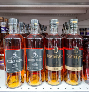 VORONEZH, Russia - April 19, 2026.Display of Medny Vsadnik and Dostoevskiy XO cognac bottles in store shelf in Russia