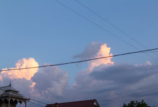 Sunset Sky Over Rural Moldova with Utility Wires and Silhouetted Trees