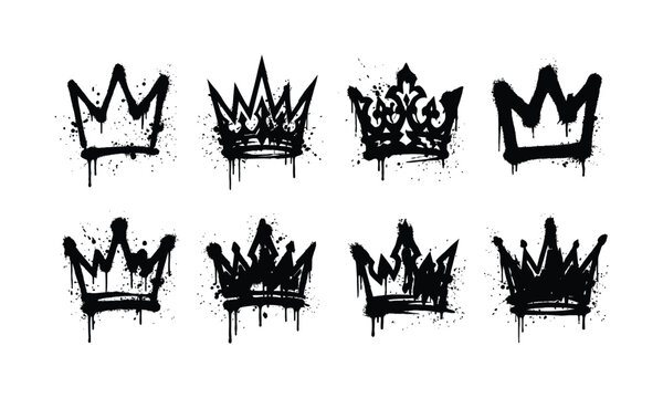 A collection of eight unique hand drawn crown illustrations created with black ink spray paint texture isolated on a white background design