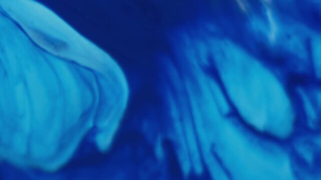 Blur emulsion. Ink drip. Blue mix color dye pigment acrylic spill enamel liquid. Blur abstract splatter flow dissolve texture background.
