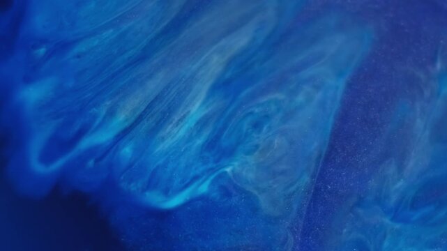 Paint spill. Pigment liquid. Blue acrylic stream mix blend. Color shimmering splatter diffusion abstract emulsion defocused background.