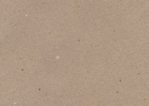 Brown cardboard paper background. Packing material, wooden texture for design. Vintage paper antique texture.	