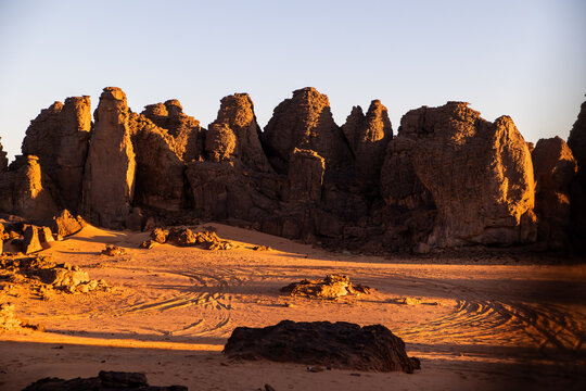 Rock Pinnacles at Sunrise With Distant Vehicle