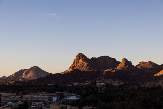 Desert Mountains Glowing at Sunset Near Djanet