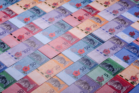 Malaysian ringgit banknotes as a tool for trade and financial transactions. The Malaysian ringgit