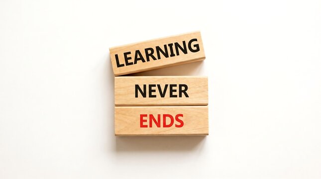 Learning never ends text on wooden blocks. Concept of continuous education and growth.