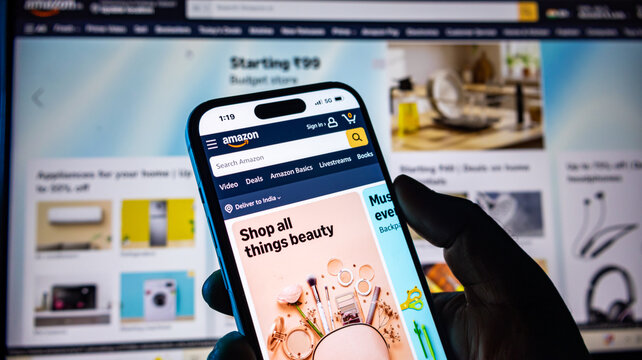 Shopping beauty products on amazon mobile app using modern smartphone.