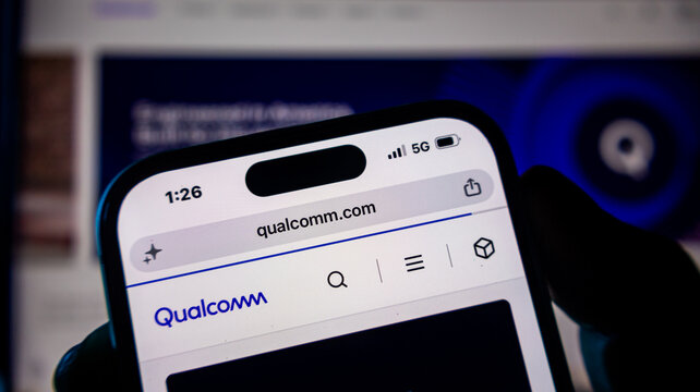 Mobile phone showing qualcomm website with focus on tech branding.