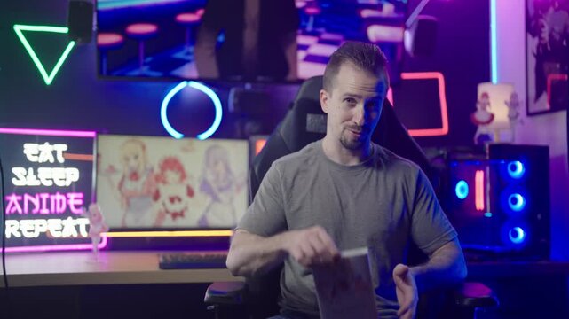Anituber influencer reviewing comic book streaming from anime geek neon room