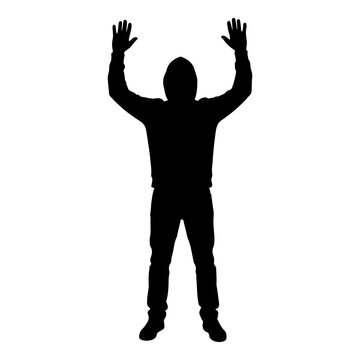 Silhouette of a hooded man standing with hands raised up in surrender black vector