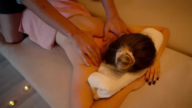 Massaging Back Muscle Stress Relief Therapy. Relaxation Massage. Body Care