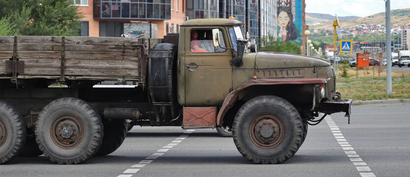 Kazakhstan, Ust-Kamenogorsk, july 26, 2026: Side view of a Soviet Ural 4320 military truck driving along a city street