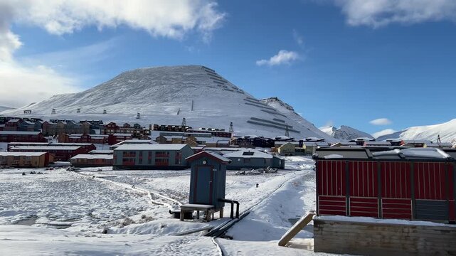 Longyearbyen settlement nestled beneath majestic Arctic mountains