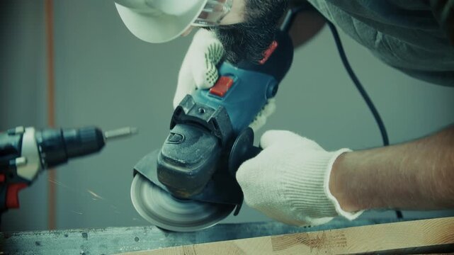 Worker Cutting Metal Bar With Angle Grinder Power Tool. Workshop. Manual Labor 