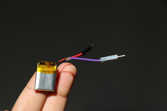 Lipo battery or the lithium polymer battery held in hand finds its use in small electronic components and diy projects