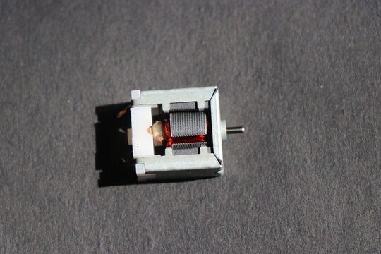 Open frame brushed dc motor with a view of its inside parts