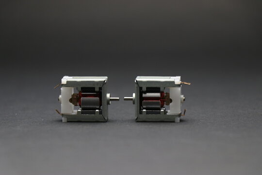 Open frame dc motor exposing internal rotor coils and shaft