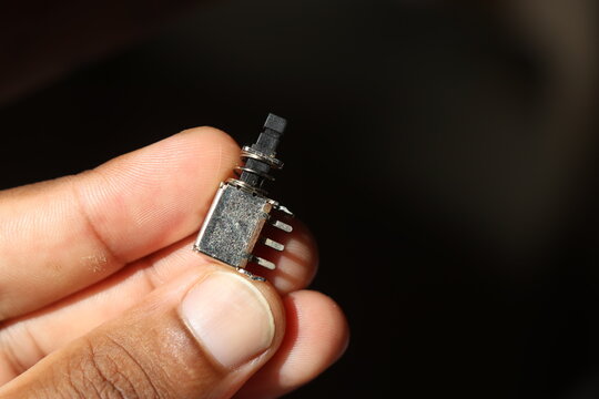 Push button switch held in hand for electronics power control