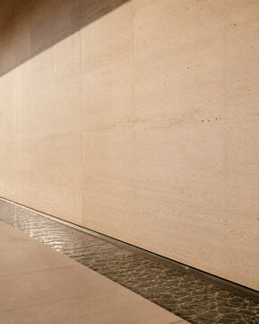 Warm Beige Stone Wall with Minimal Linear Detail