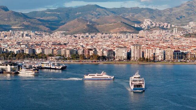 Passenger ferry and car ferry operating near ferry terminal in coastal city. Public water transportation and urban bay traffic