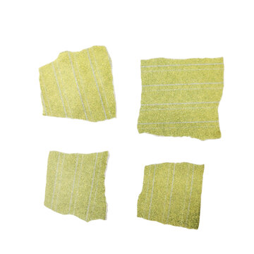 Four abstract green pixelated shapes on white background